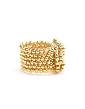 Anillo de oro con cuentas entrelazadas